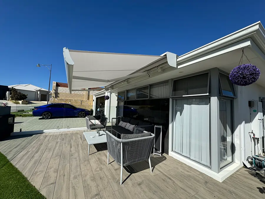 Modern patio with folding arm awnings installed by Outdoor Shades WA for retractable sun protection and outdoor comfort