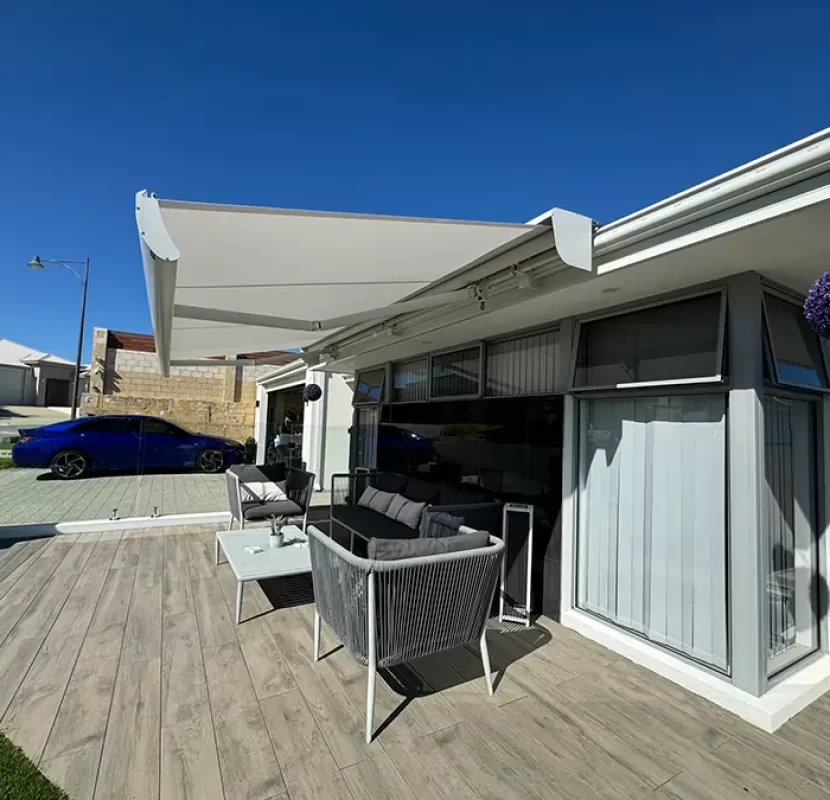 Modern patio with folding arm awnings installed by Outdoor Shades WA for retractable sun protection and outdoor comfort